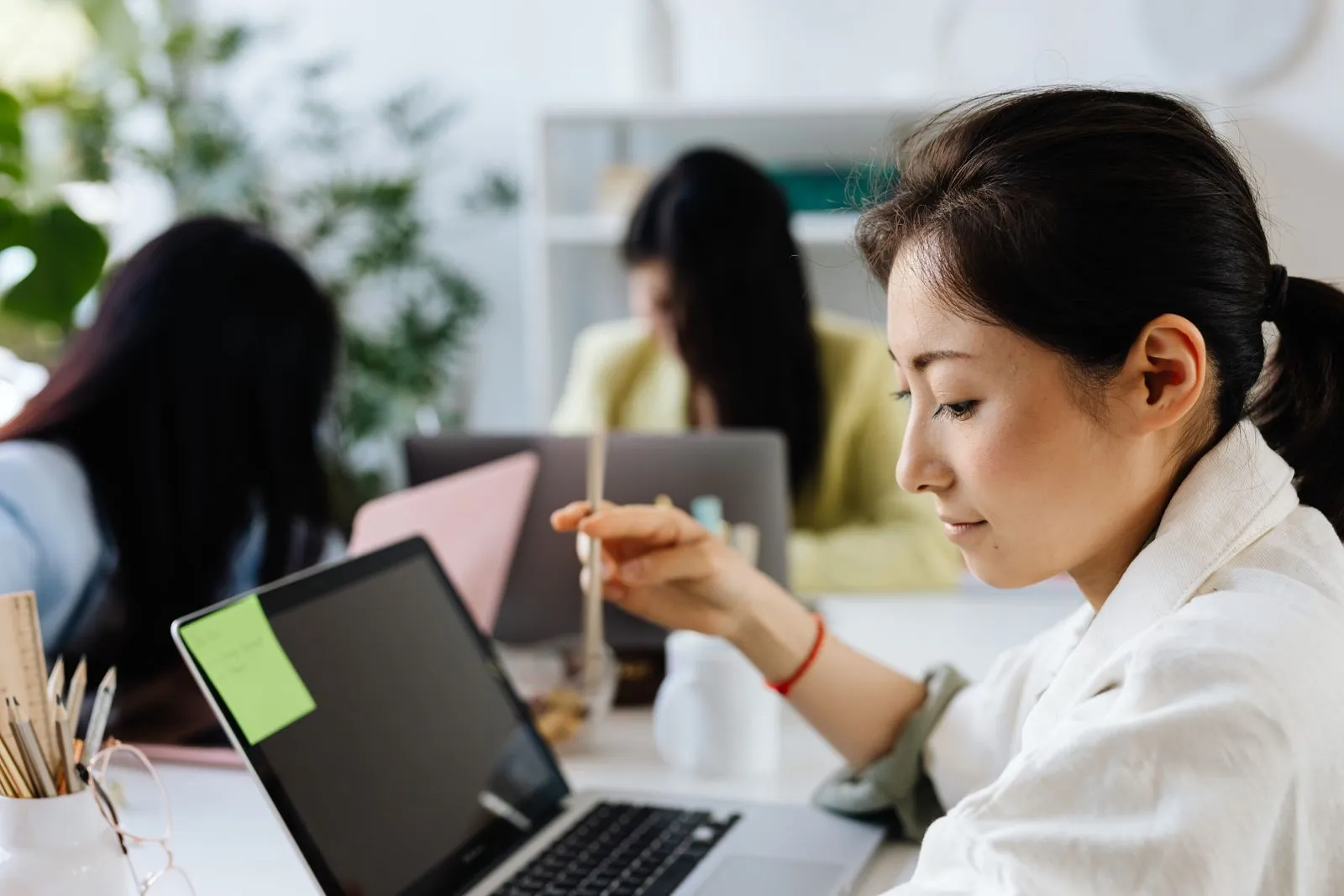 A care professional working through training on a laptop