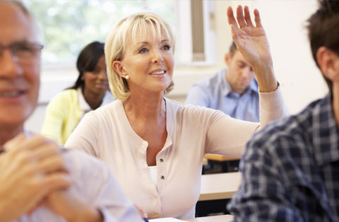 leadership courses hand raised - Engagement Through Education | Assisted Living Classes