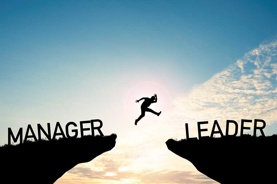 when to lead and when to manage your team silloutte jumping between words