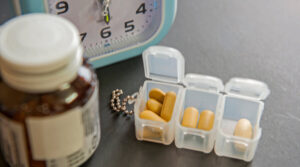 pill-case-bottle-and-small-clock-medication-errors